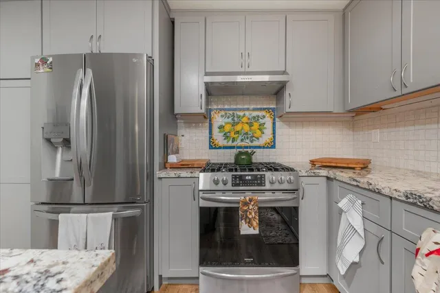 a bedroom with furniture and wooden floor