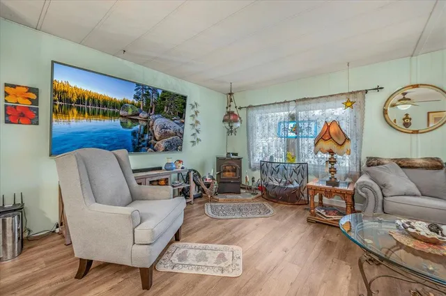 a living room with furniture and kitchen view