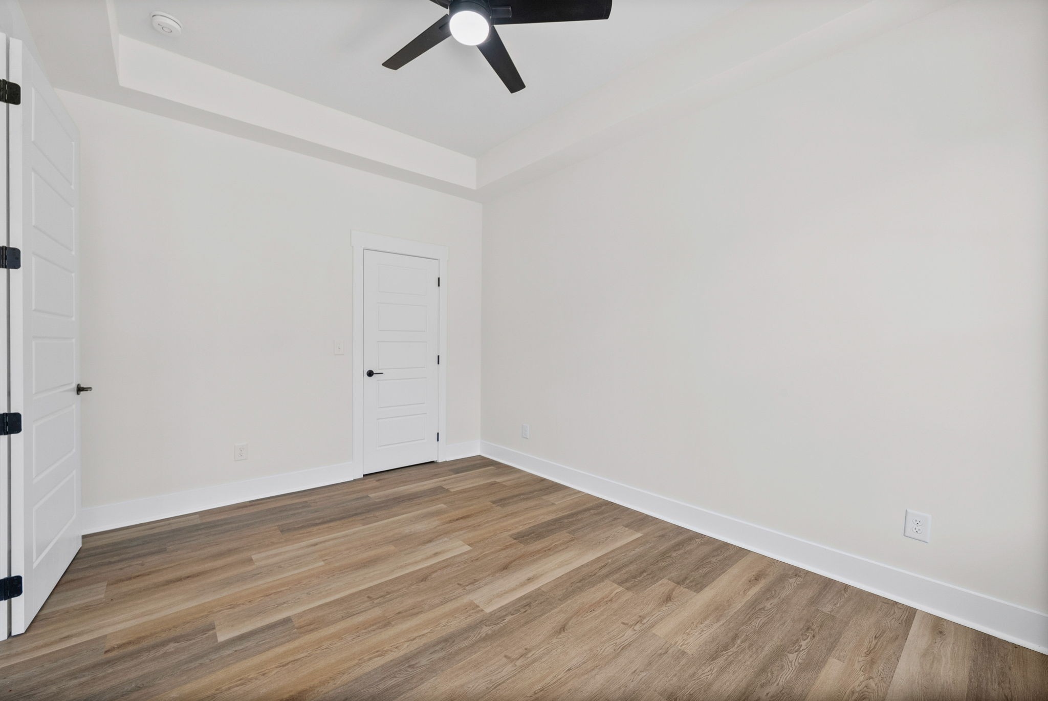 442 Centre Street Pleasant View, TN 37146 - Photo 12 of 47 a view of an empty room with wooden floor