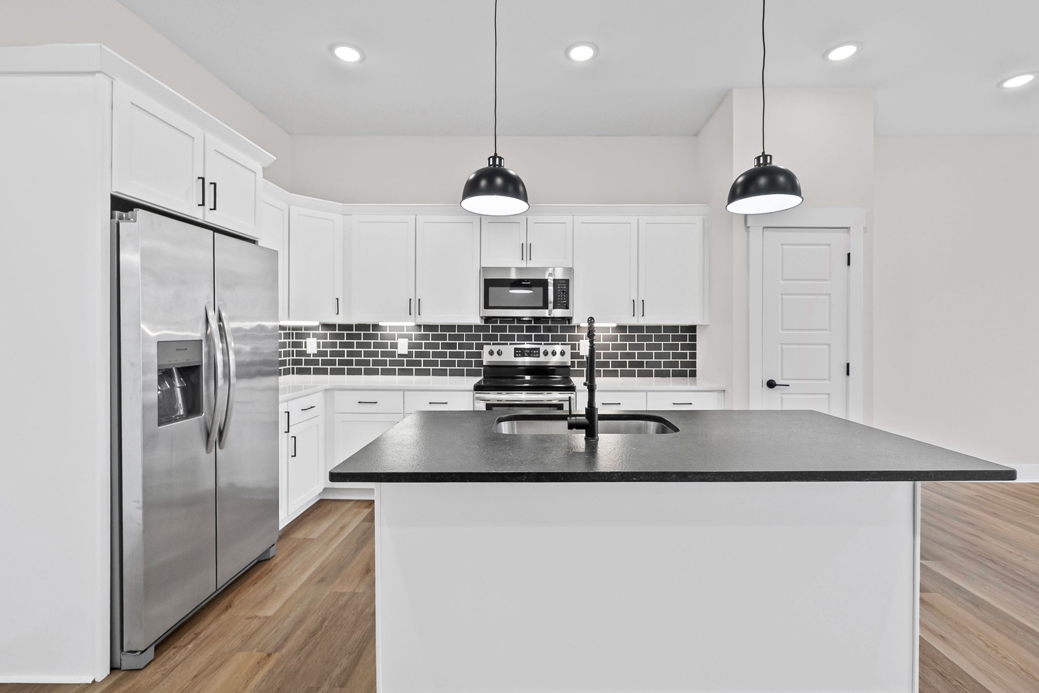 442 Centre Street Pleasant View, TN 37146 - Photo 21 of 47 a kitchen with stainless steel appliances granite countertop a sink a stove a refrigerator and cabinets