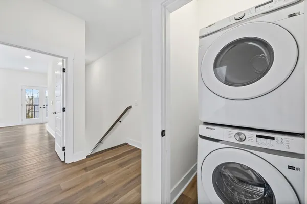 an empty room with closet and windows