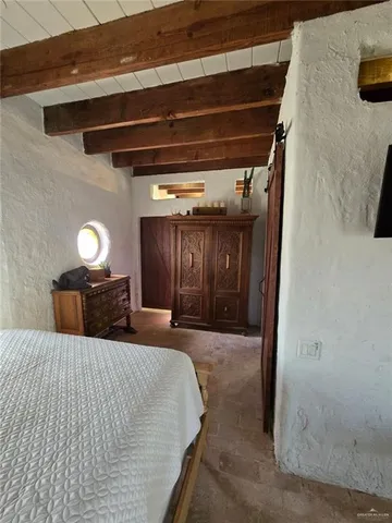 a bed room with a bed and a night stand