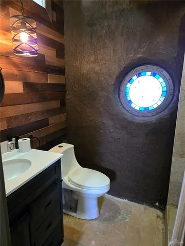 a bathroom with a toilet and a sink