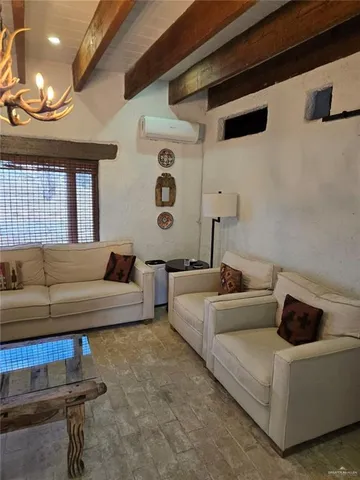 a living room with furniture and a window