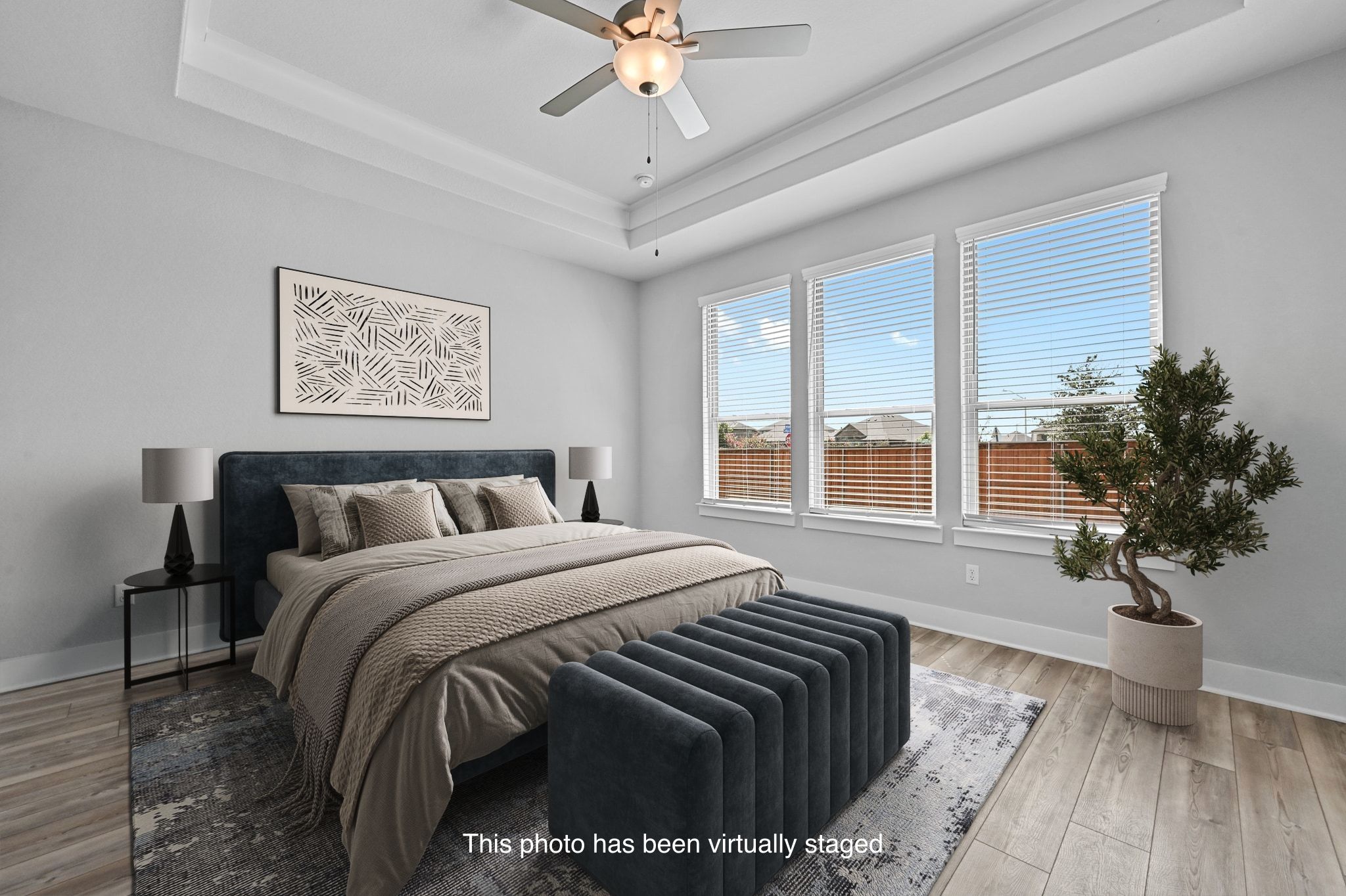 284 Grace Lilly Drive Buda, TX 78610 - Photo 18 of 40 a bedroom with a large bed and a chandelier