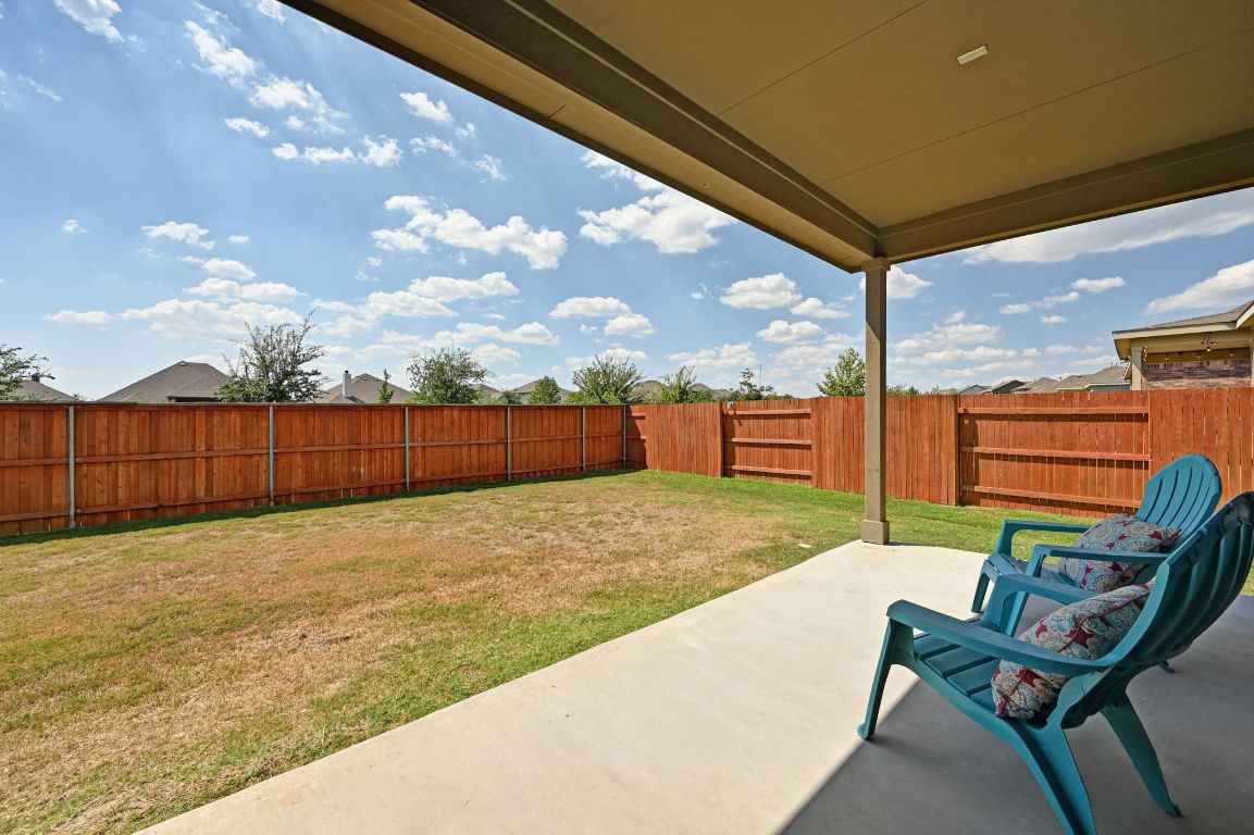 284 Grace Lilly Drive Buda, TX 78610 - Photo 28 of 40 Fenced backyard with a patio area
