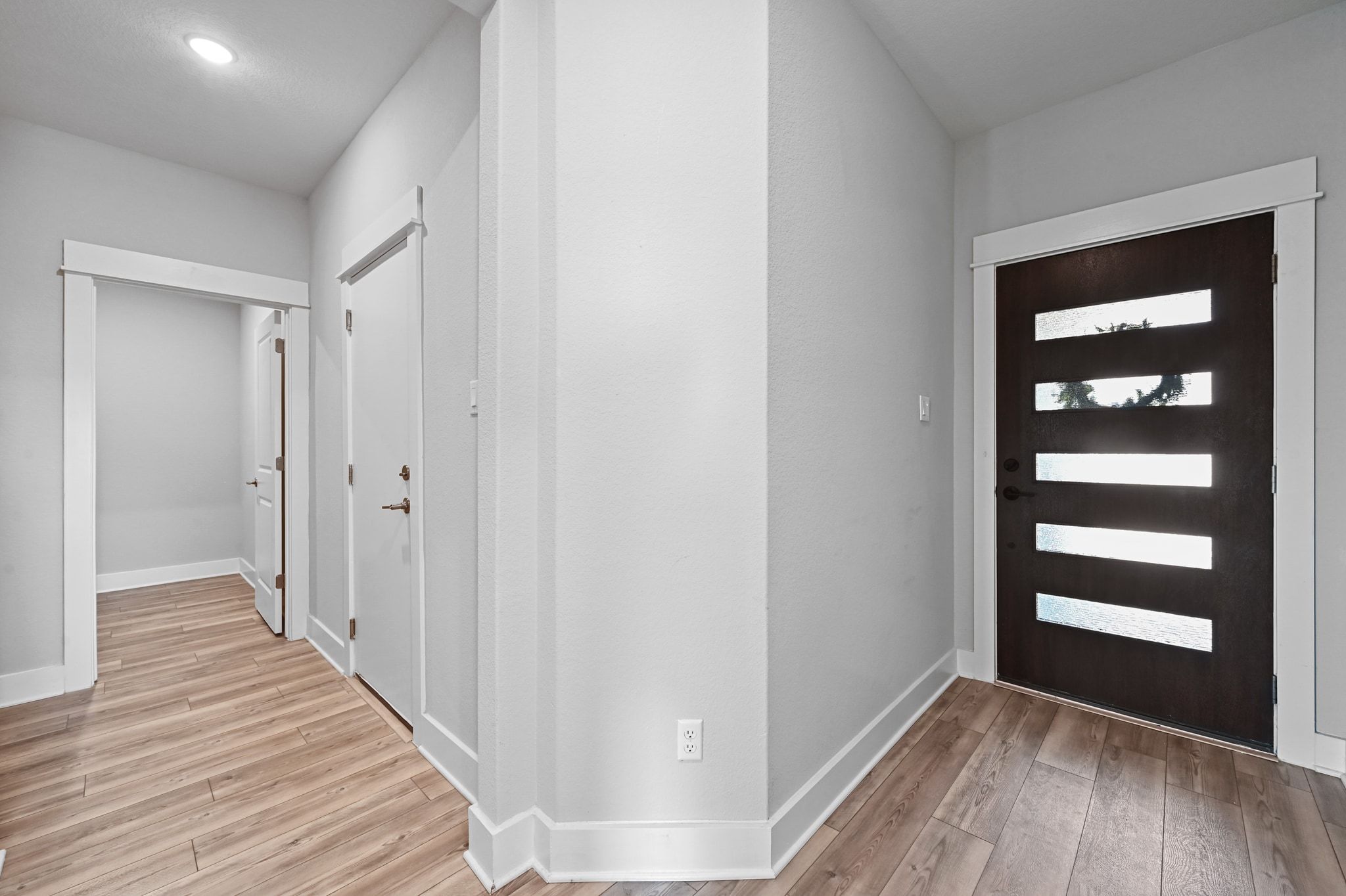 284 Grace Lilly Drive Buda, TX 78610 - Photo 8 of 40 a view of a hallway with wooden floor and closet