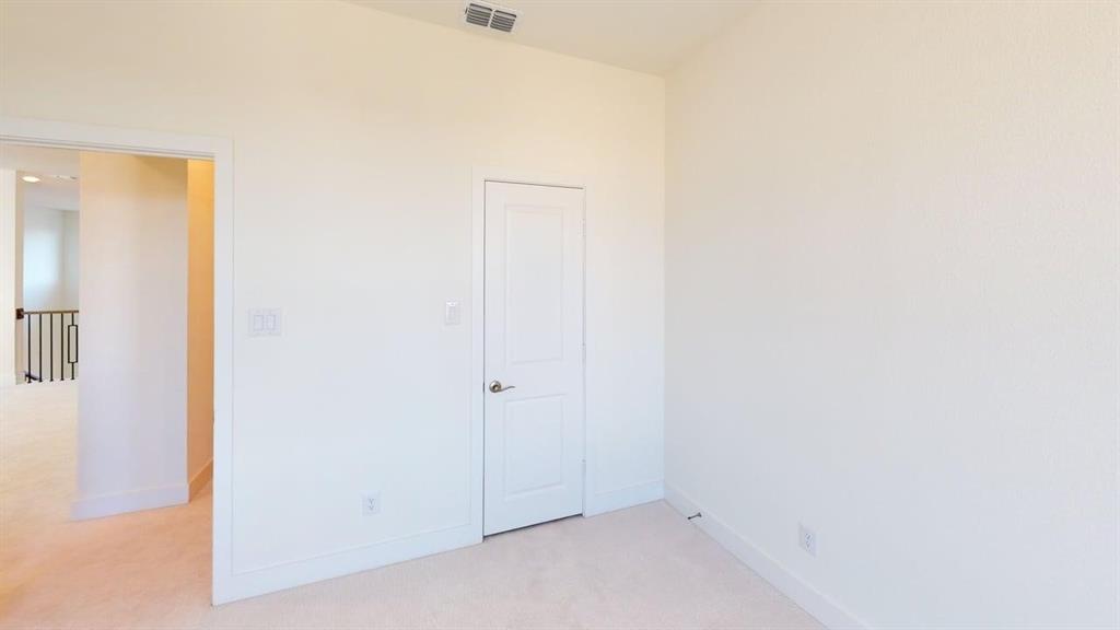 7013 Lathrop Lane Frisco, TX 75033 - Photo 15 of 26 Unfurnished bedroom with light carpet and baseboards
