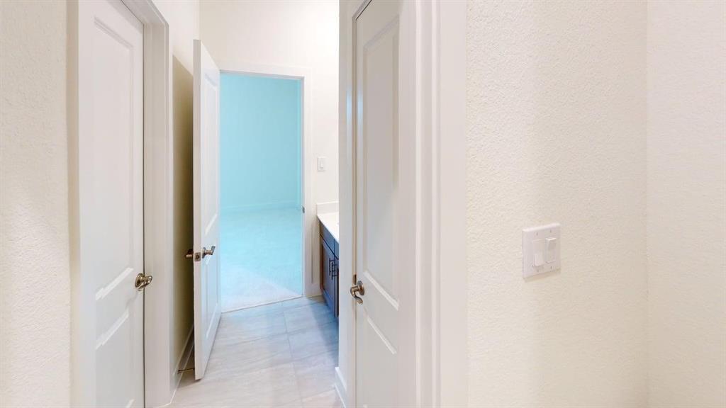 7013 Lathrop Lane Frisco, TX 75033 - Photo 18 of 26 Corridor with a textured wall