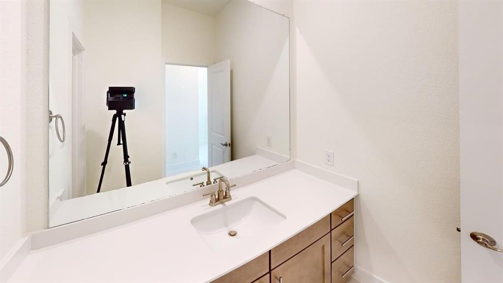 7013 Lathrop Lane Frisco, TX 75033 - Photo 20 of 26 Bathroom with vanity
