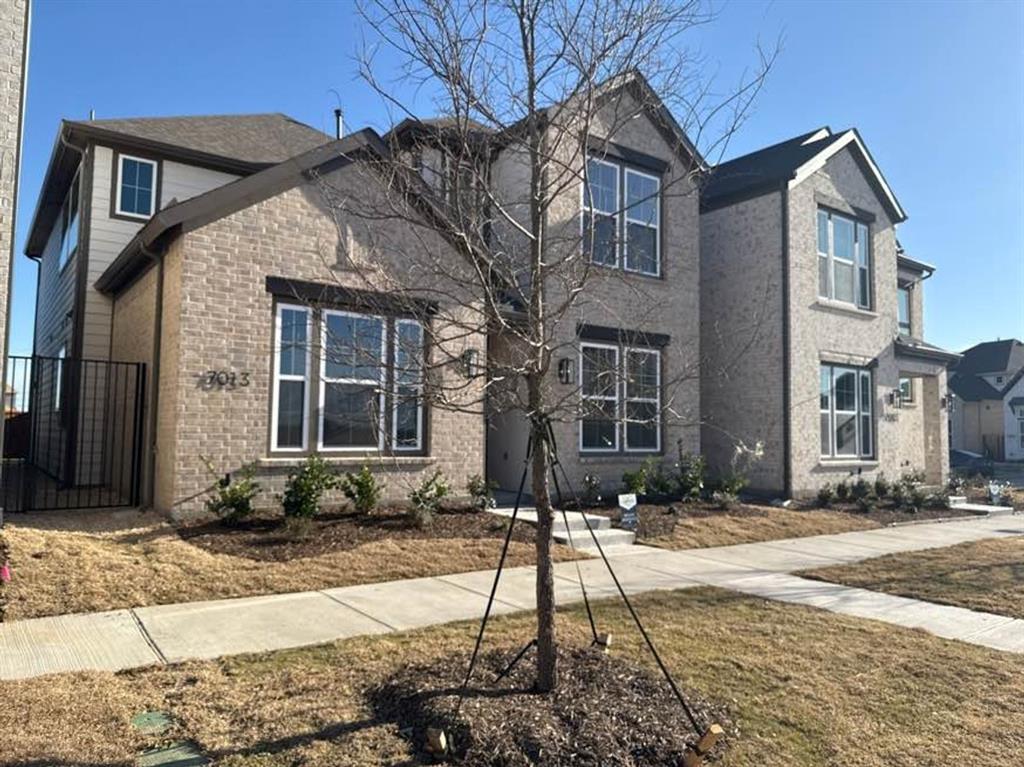 7013 Lathrop Lane Frisco, TX 75033 - Photo 2 of 26 Traditional-style home featuring brick siding