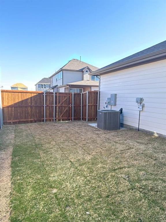 7013 Lathrop Lane Frisco, TX 75033 - Photo 26 of 26 Fenced backyard featuring a gate