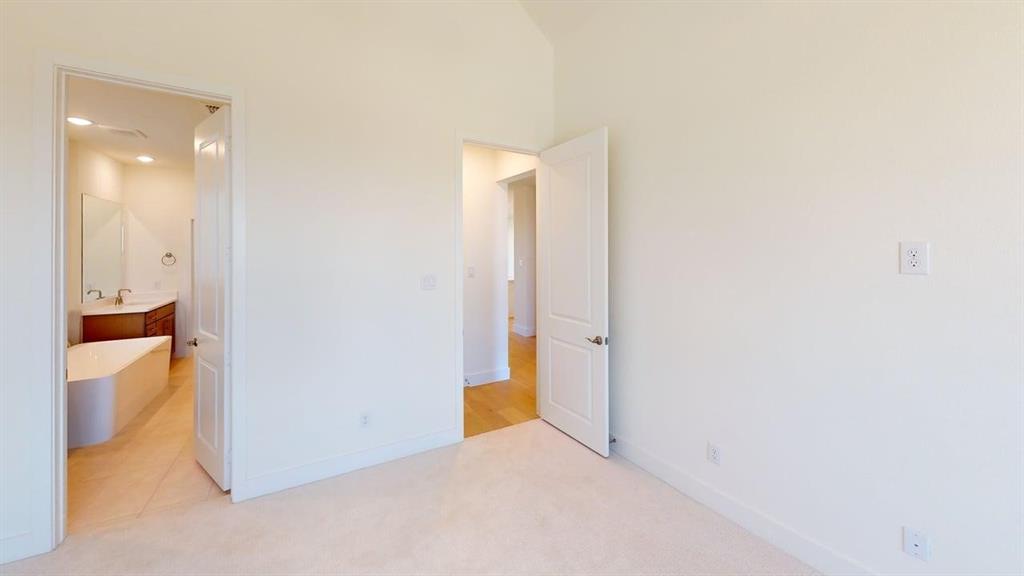 7013 Lathrop Lane Frisco, TX 75033 - Photo 10 of 26 Unfurnished bedroom with light carpet and ensuite bath