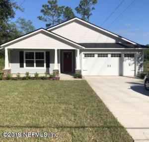 2253 Bayview Road Jacksonville, FL 32210 - Photo 1 of 15 a front view of a house with a yard and garage