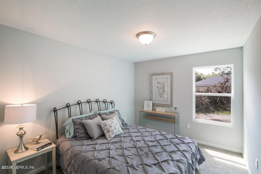 2253 Bayview Road Jacksonville, FL 32210 - Photo 12 of 15 a bedroom with a bed and window