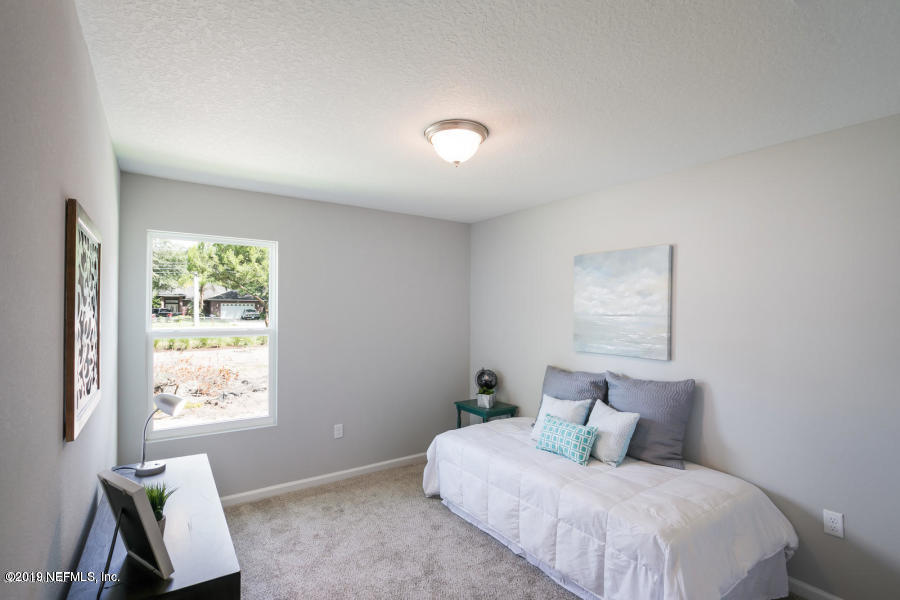2253 Bayview Road Jacksonville, FL 32210 - Photo 13 of 15 a bedroom with a bed and a window