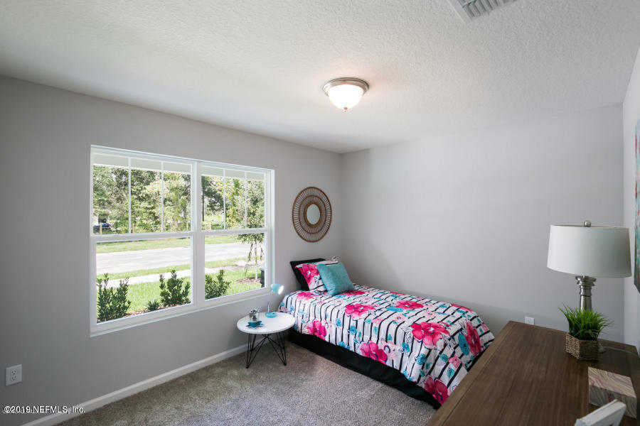 2253 Bayview Road Jacksonville, FL 32210 - Photo 14 of 15 a bed room with a bed and a window