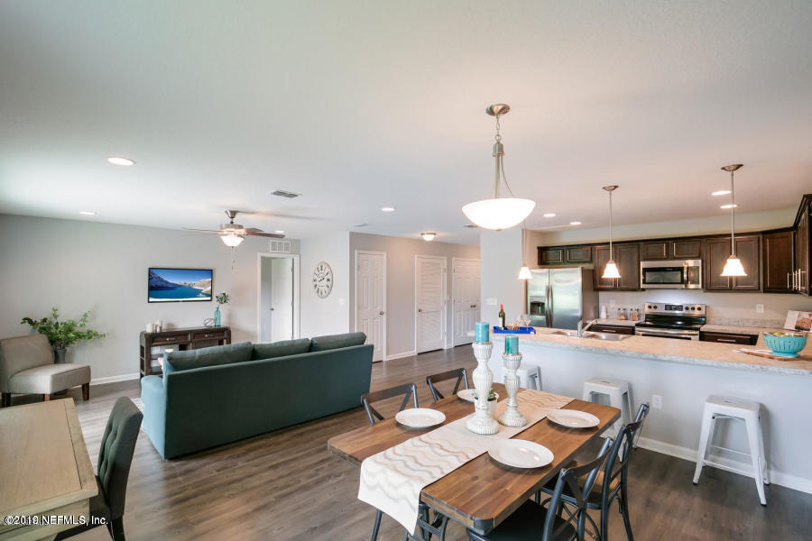 2253 Bayview Road Jacksonville, FL 32210 - Photo 7 of 15 a kitchen with a table and chairs in it