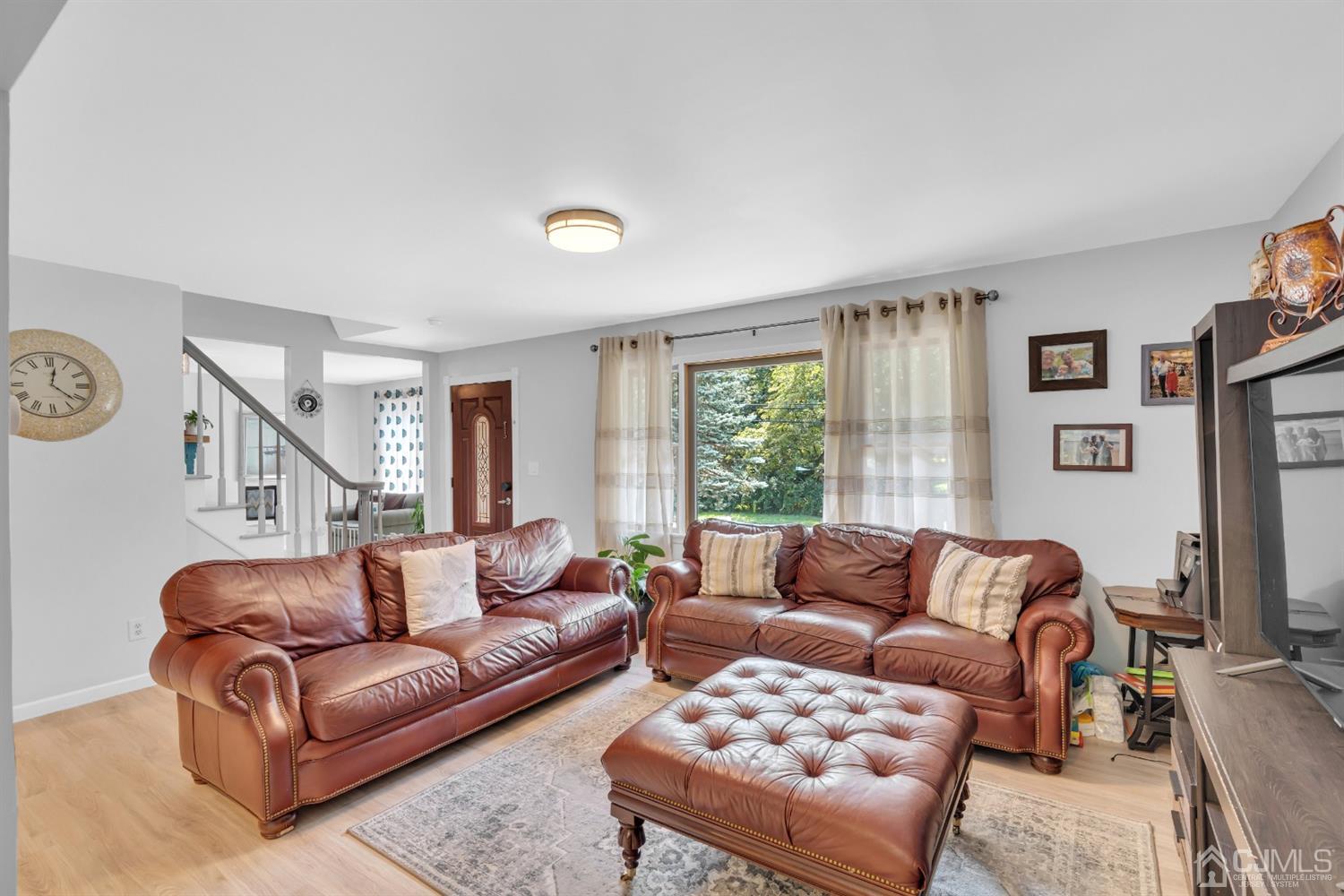 76 Bethany Road Hazlet, NJ 07730 - Photo 11 of 33 a living room with furniture window and a flat screen tv