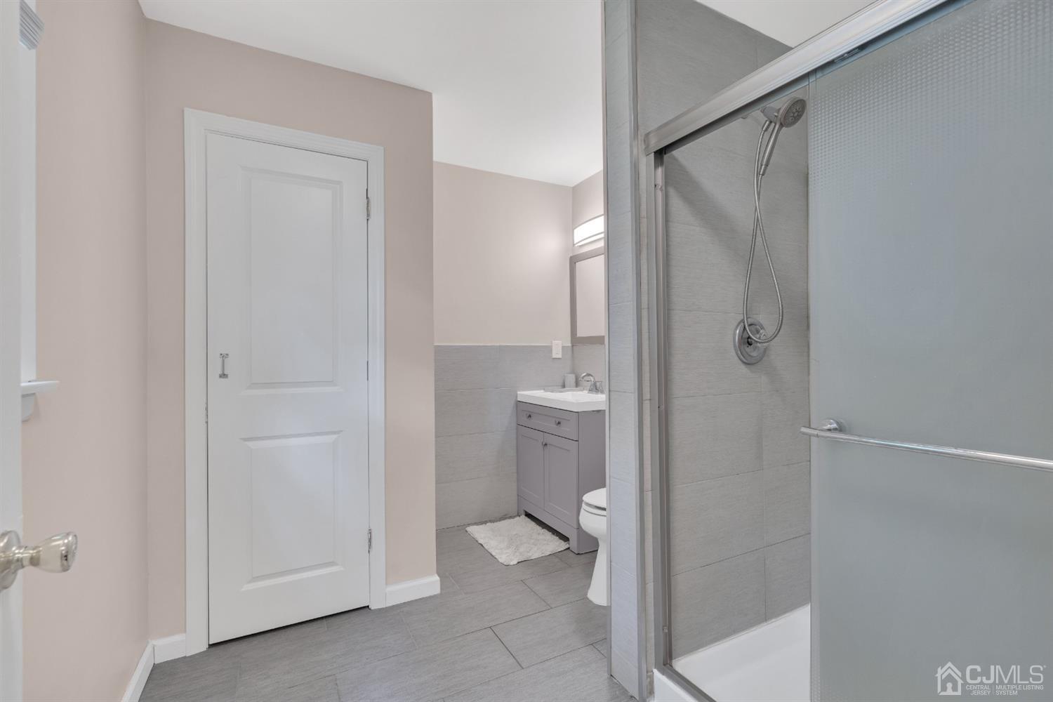 76 Bethany Road Hazlet, NJ 07730 - Photo 18 of 33 a bathroom with a granite countertop sink mirror and toilet