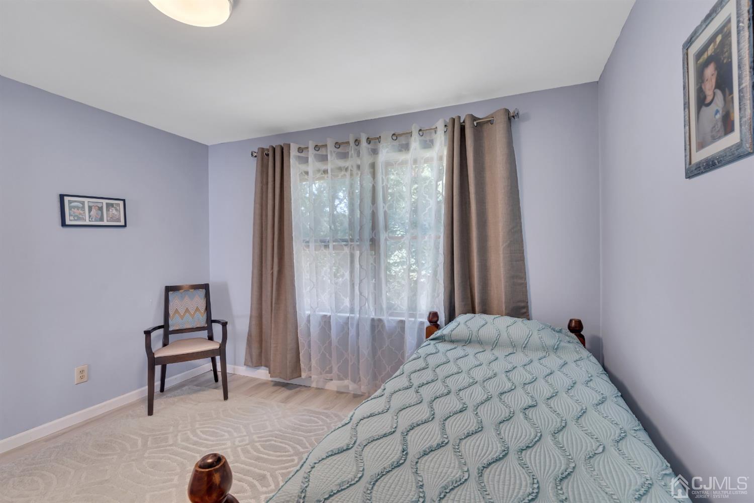 76 Bethany Road Hazlet, NJ 07730 - Photo 22 of 33 a bedroom with a bed and a window