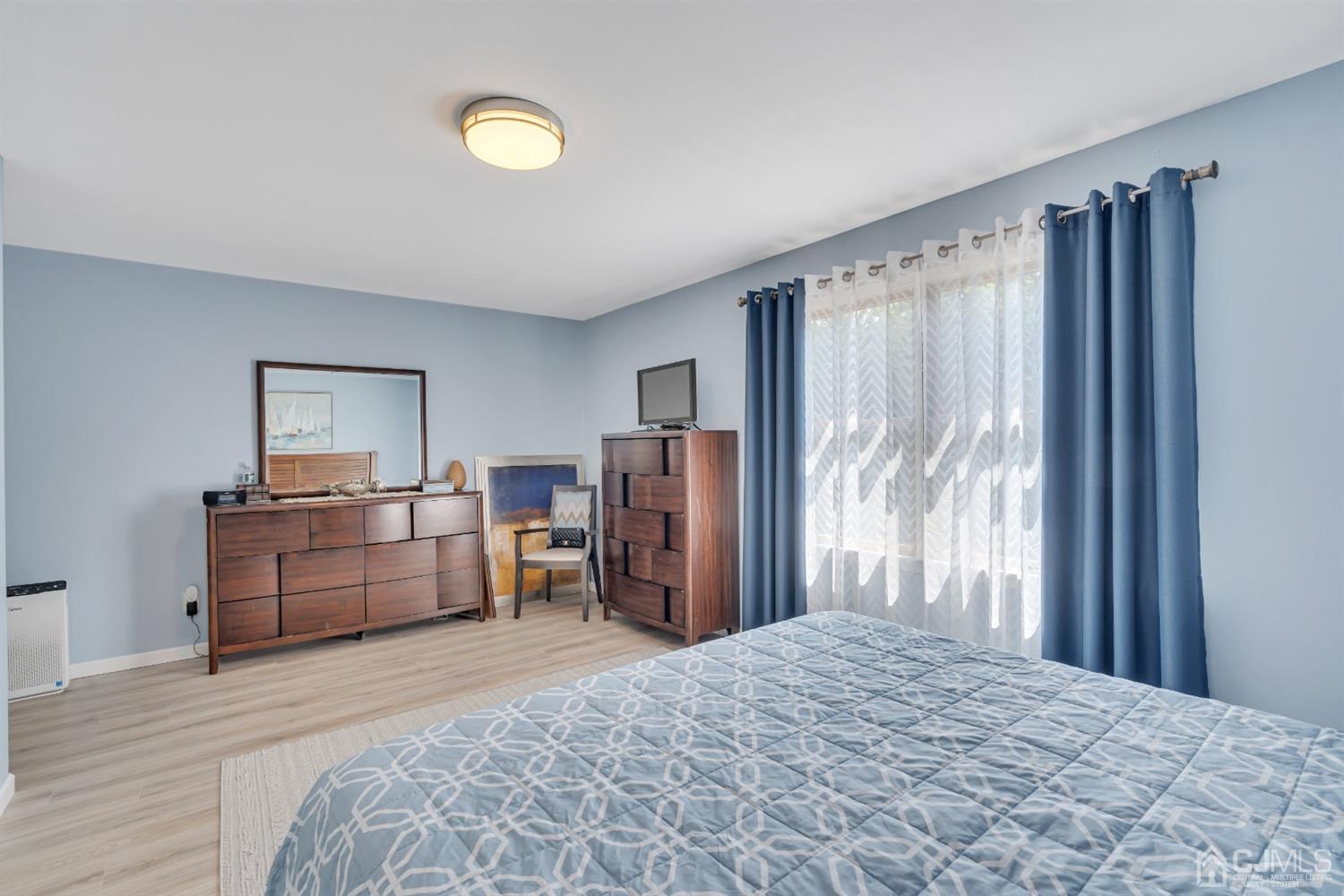 76 Bethany Road Hazlet, NJ 07730 - Photo 24 of 33 a bedroom with a bed and a dresser