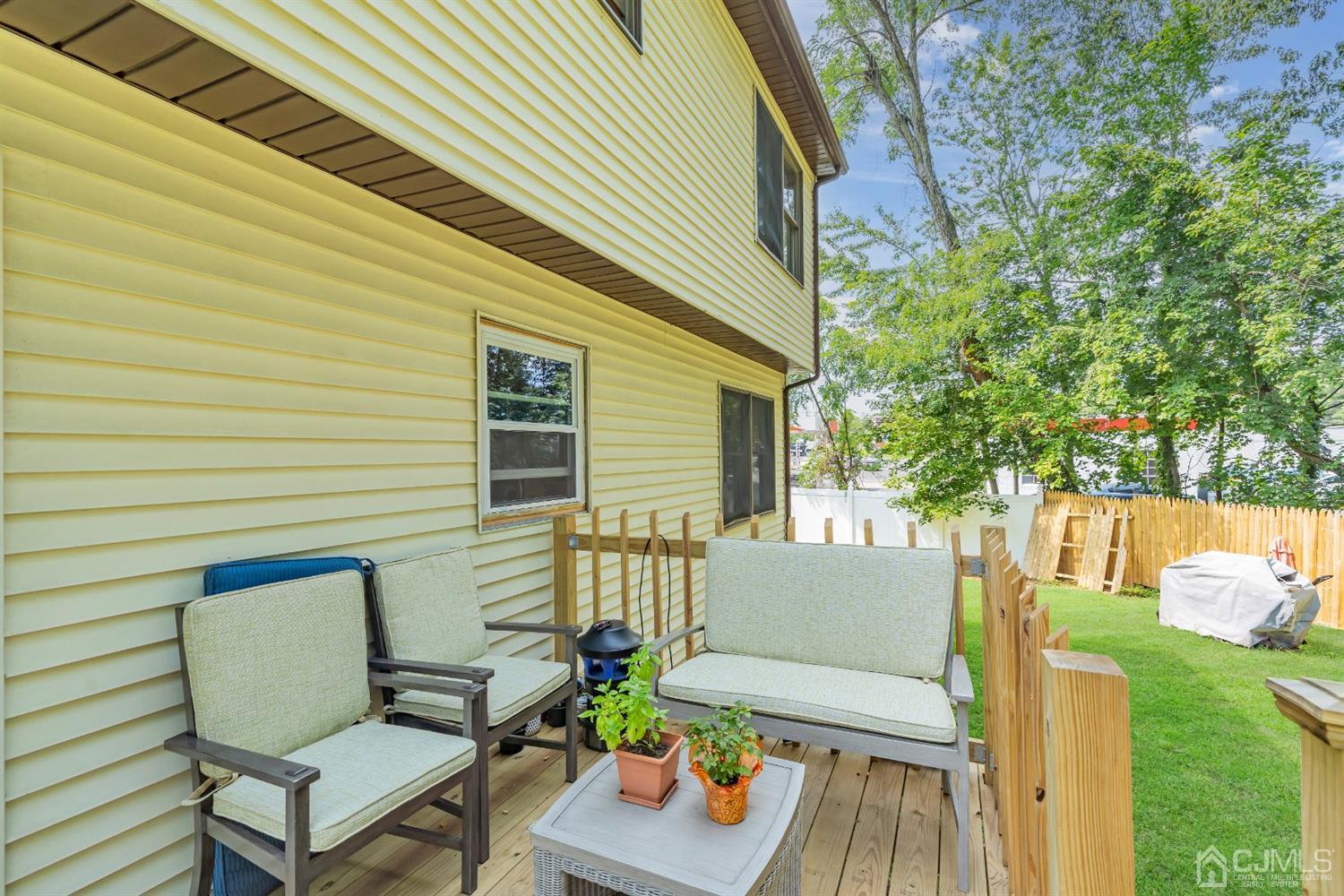 76 Bethany Road Hazlet, NJ 07730 - Photo 32 of 33 a view of a patio with couches chairs and a potted plant