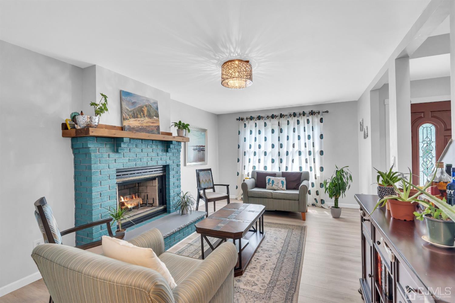 76 Bethany Road Hazlet, NJ 07730 - Photo 6 of 33 a living room with furniture and a fireplace