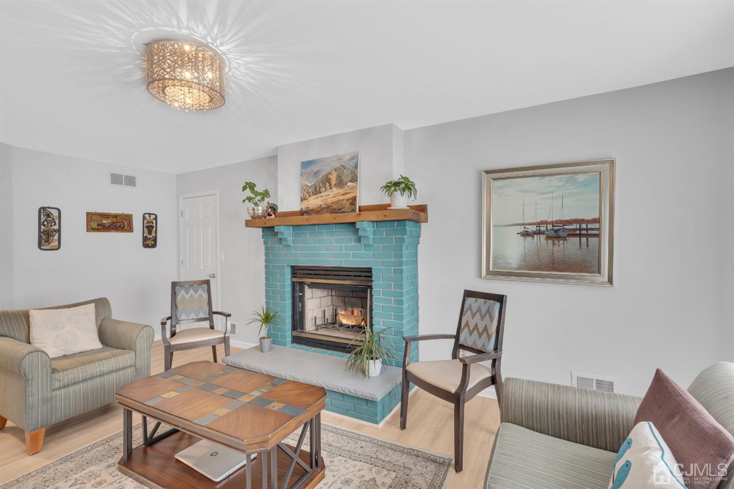 76 Bethany Road Hazlet, NJ 07730 - Photo 7 of 33 a living room with furniture and a fireplace