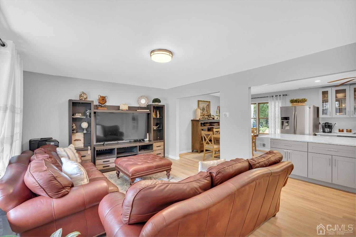 76 Bethany Road Hazlet, NJ 07730 - Photo 9 of 33 a living room with furniture and a flat screen tv