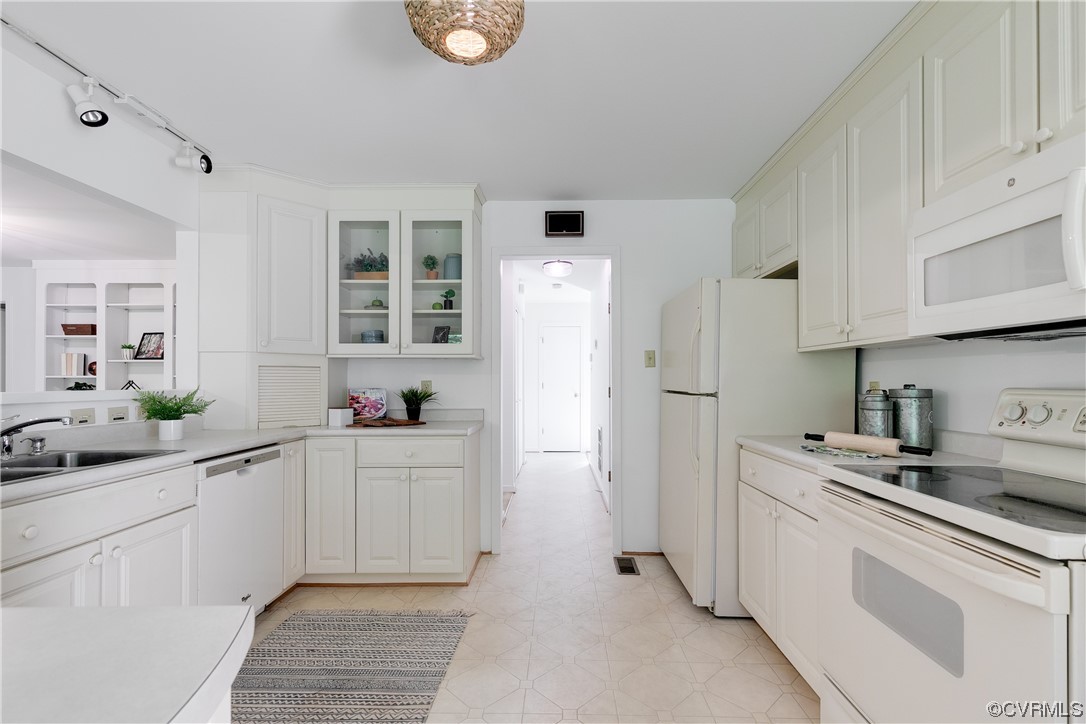 4000 Cheyenne Road Richmond, VA 23235 - Photo 13 of 50 a kitchen with white cabinets and white appliances
