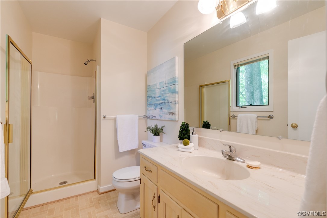 4000 Cheyenne Road Richmond, VA 23235 - Photo 24 of 50 a bathroom with a granite countertop sink toilet and shower