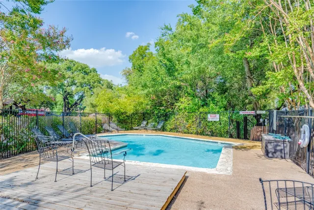 a view of a chairs and table in the patio