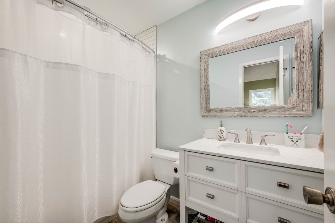11821 Bittern Hollow, Unit 34 Austin, TX 78758 - Photo 10 of 24 Bathroom with vanity and curtained shower