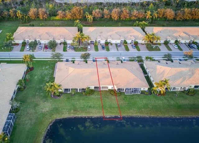an aerial view of a house with yard swimming pool and outdoor seating