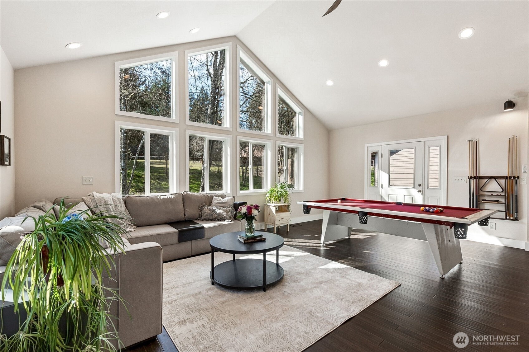 6103 Lackey Road Northwest Vaughn, WA 98394 - Photo 11 of 37 a living room with furniture and a large window