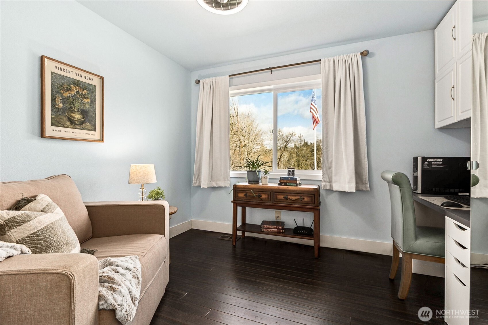 6103 Lackey Road Northwest Vaughn, WA 98394 - Photo 13 of 37 a living room with furniture a flat screen tv and a window