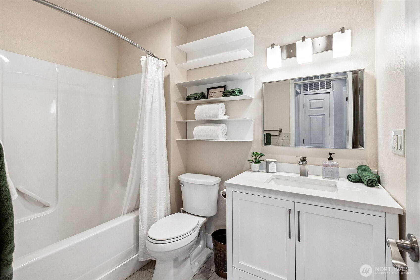 6103 Lackey Road Northwest Vaughn, WA 98394 - Photo 15 of 37 a bathroom with a sink toilet vanity and tub