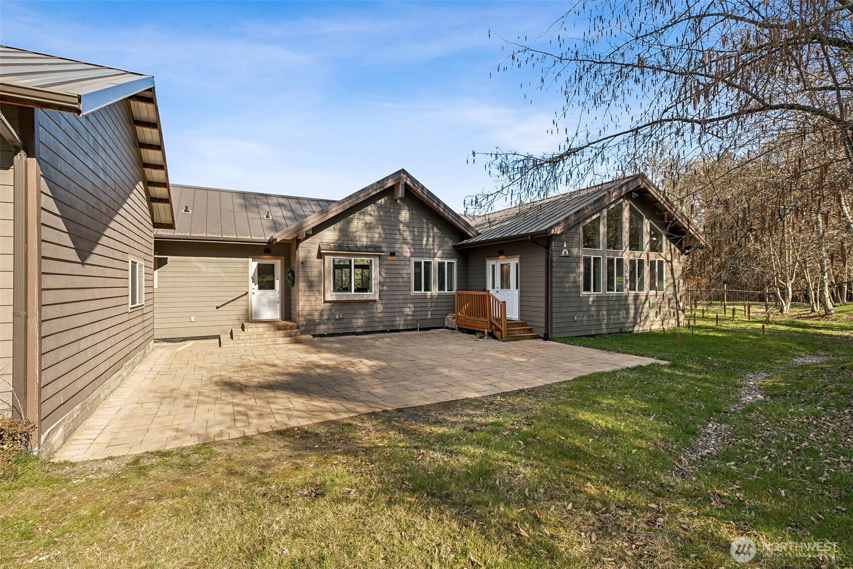 6103 Lackey Road Northwest Vaughn, WA 98394 - Photo 17 of 37 a front view of a house with a garden