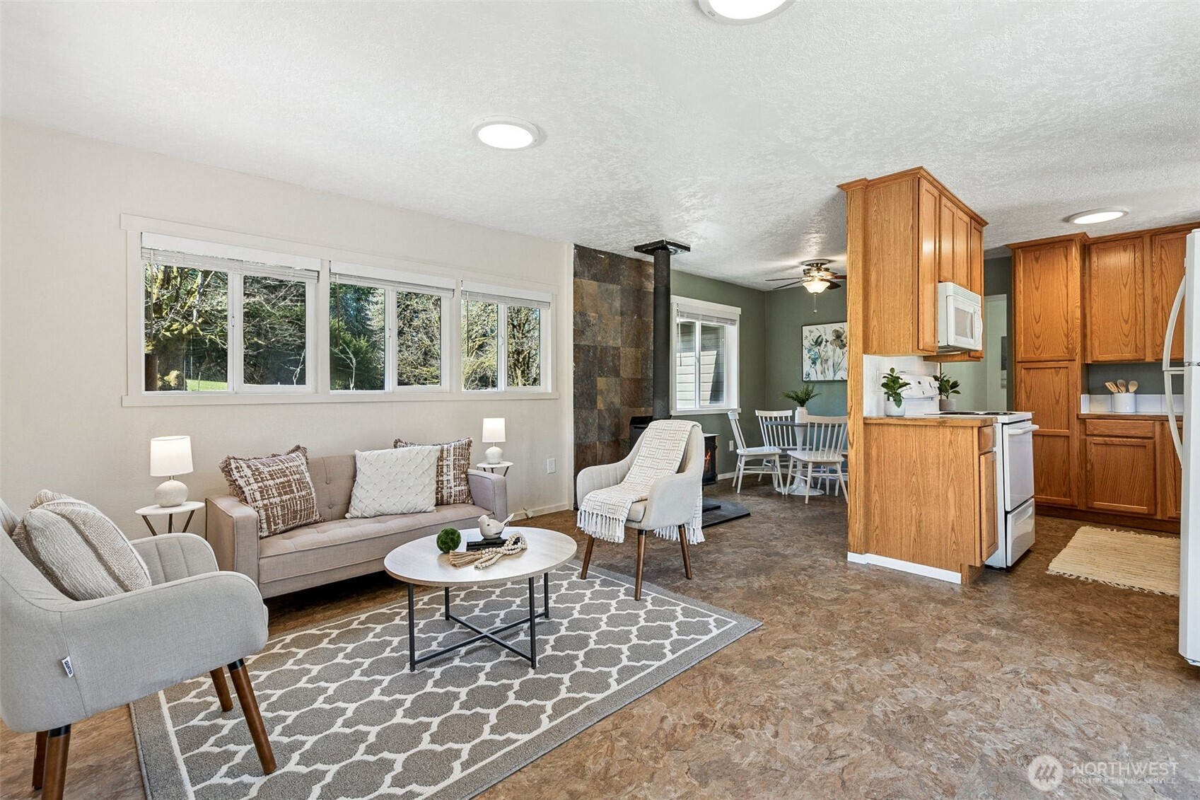 6103 Lackey Road Northwest Vaughn, WA 98394 - Photo 20 of 37 a living room with furniture and a large window