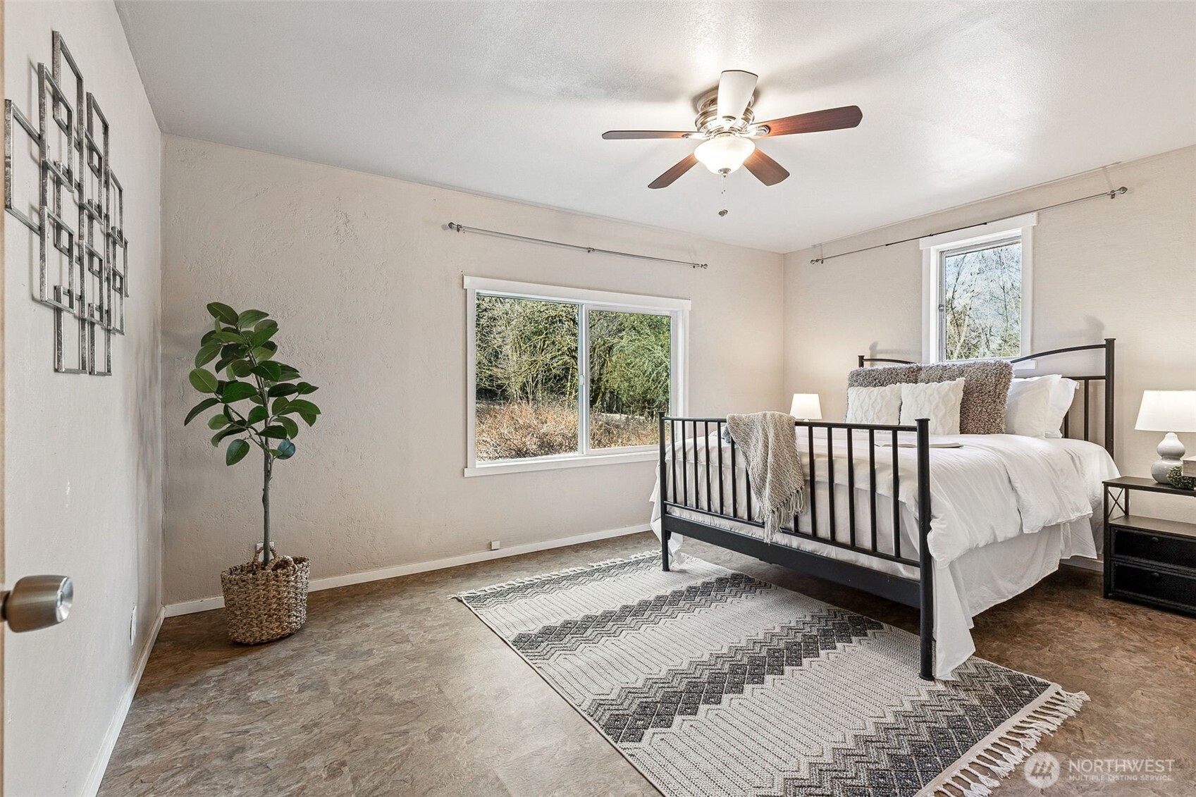 6103 Lackey Road Northwest Vaughn, WA 98394 - Photo 22 of 37 a bed sitting in a spacious bedroom next to a window