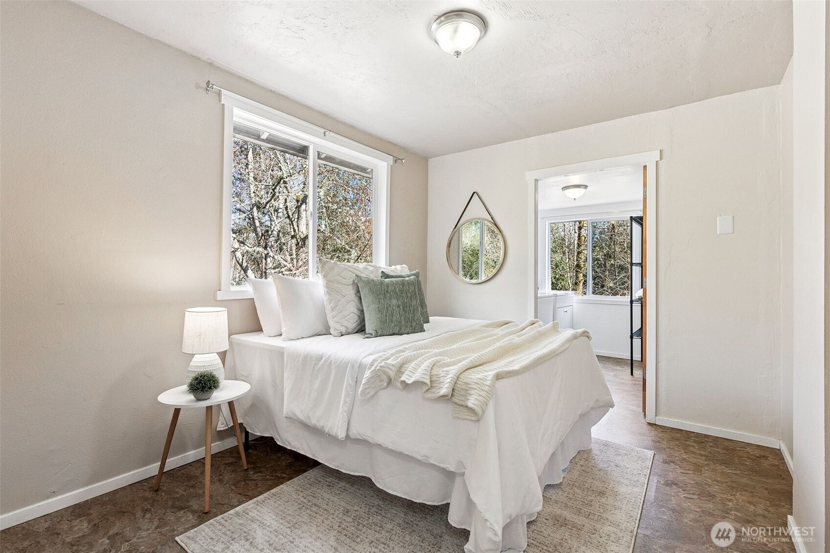 6103 Lackey Road Northwest Vaughn, WA 98394 - Photo 23 of 37 a bedroom with a large bed and a window