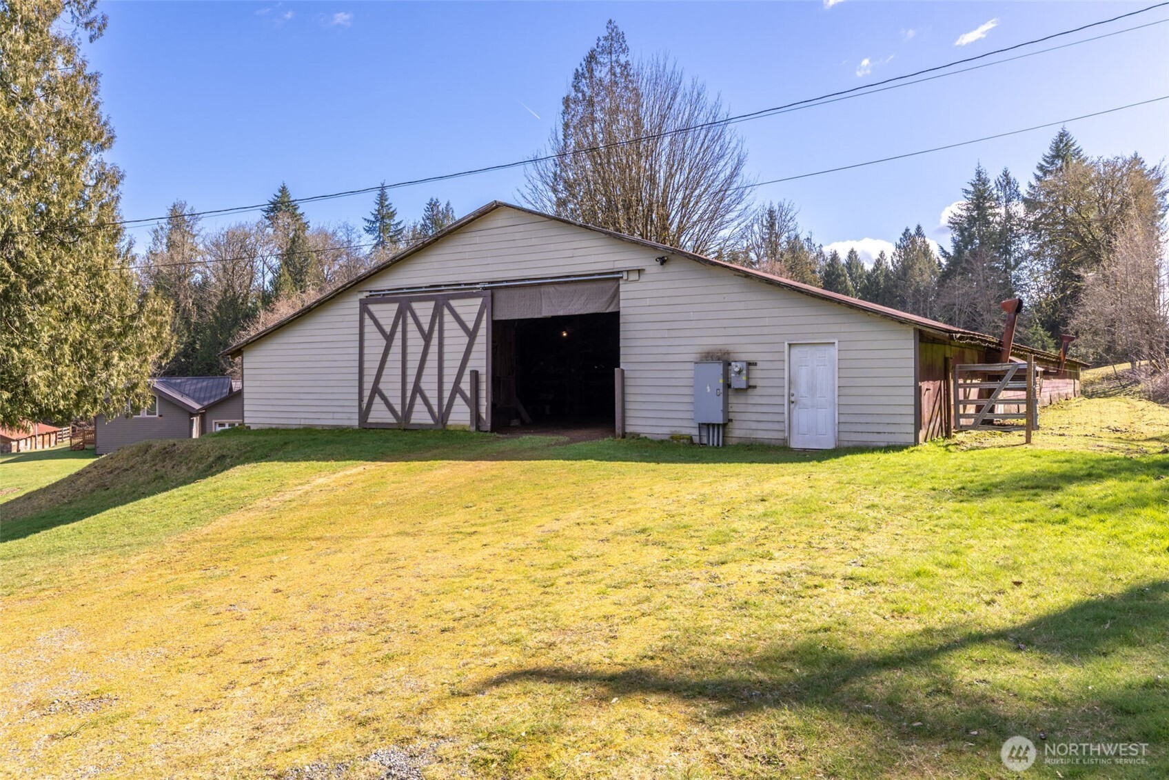 6103 Lackey Road Northwest Vaughn, WA 98394 - Photo 27 of 37 a house with a outdoor space