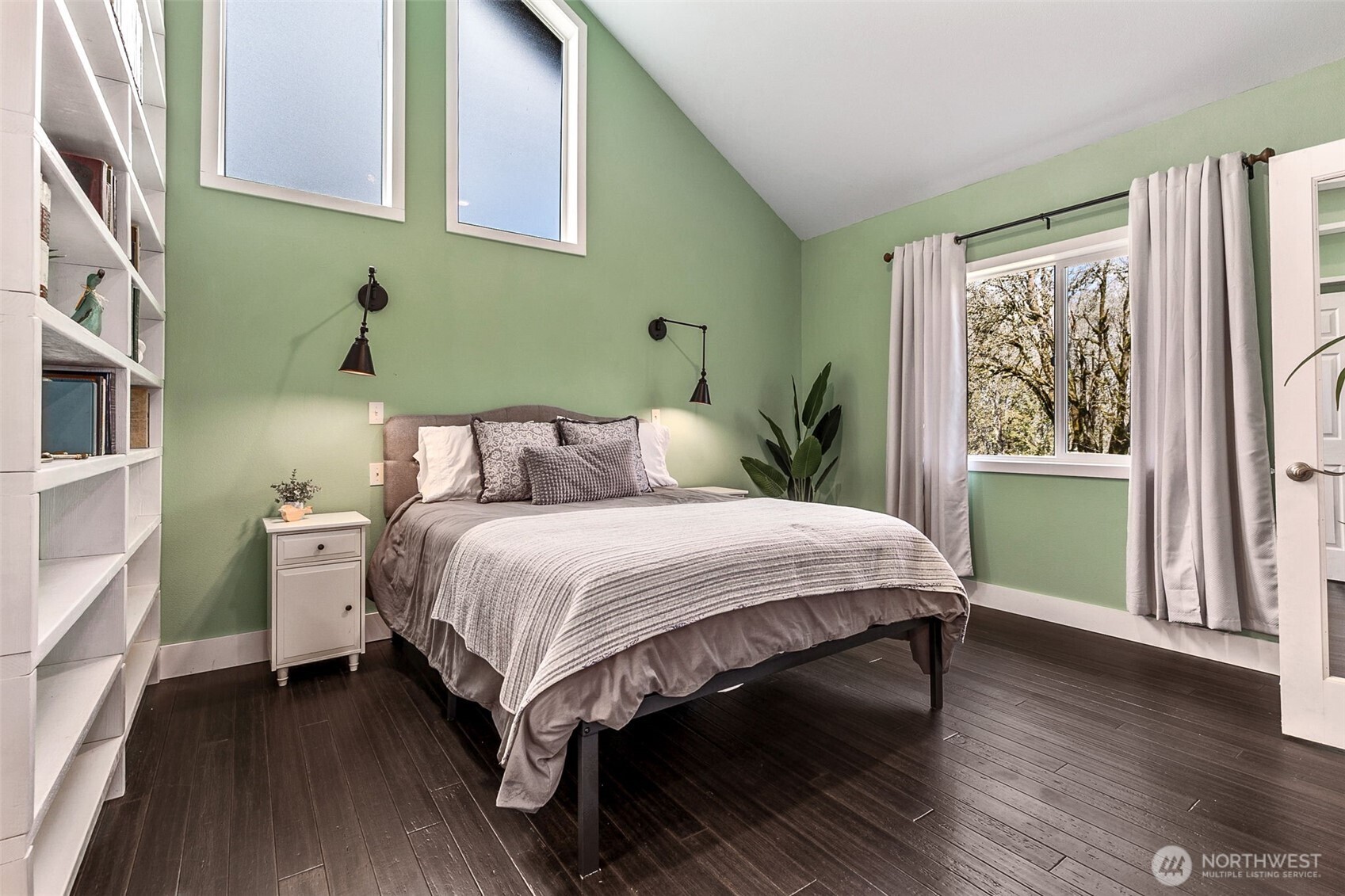 6103 Lackey Road Northwest Vaughn, WA 98394 - Photo 6 of 37 a bedroom with a bed wooden floor and window