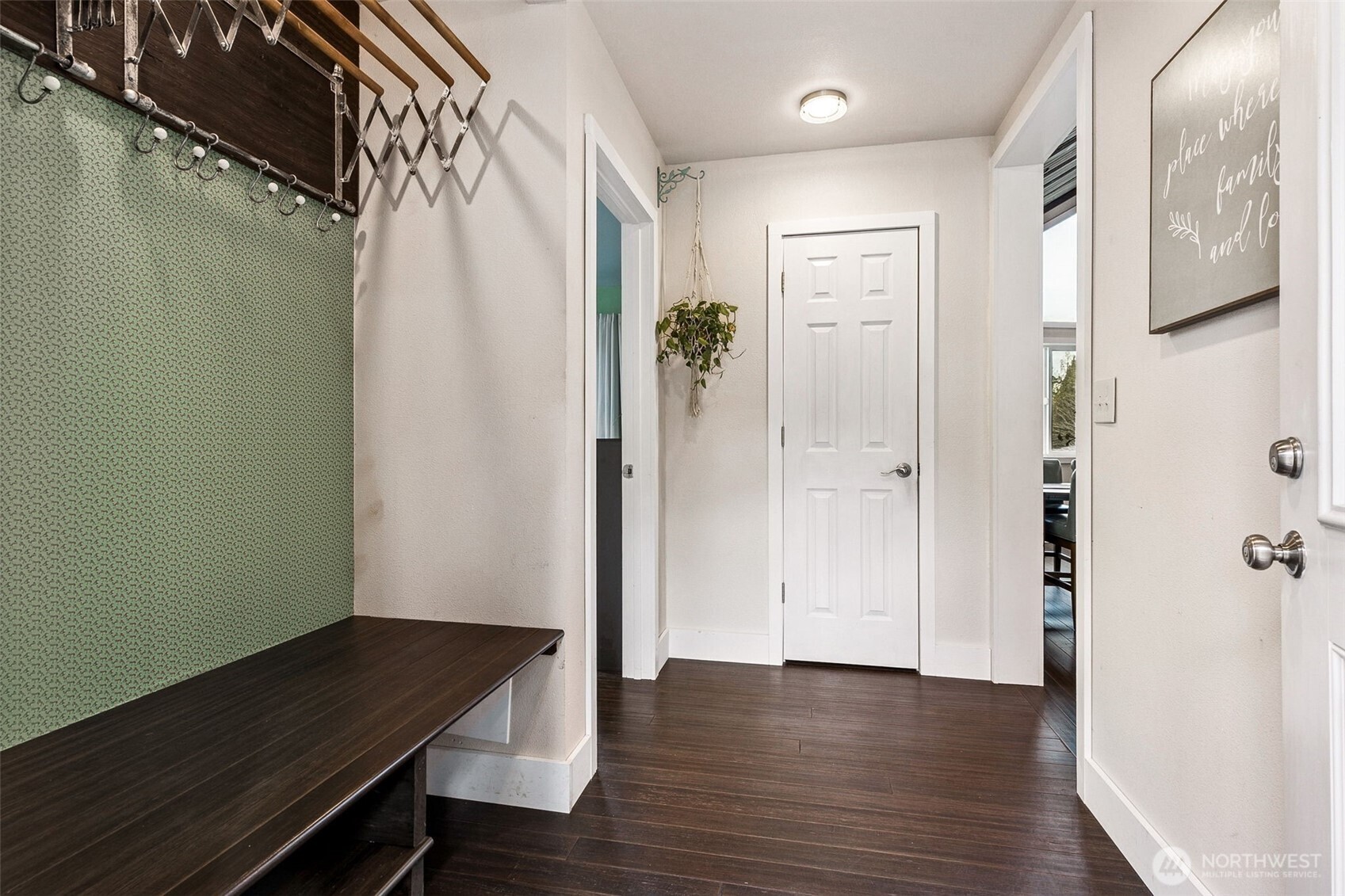 6103 Lackey Road Northwest Vaughn, WA 98394 - Photo 10 of 37 a view of a hallway with wooden floor and staircase