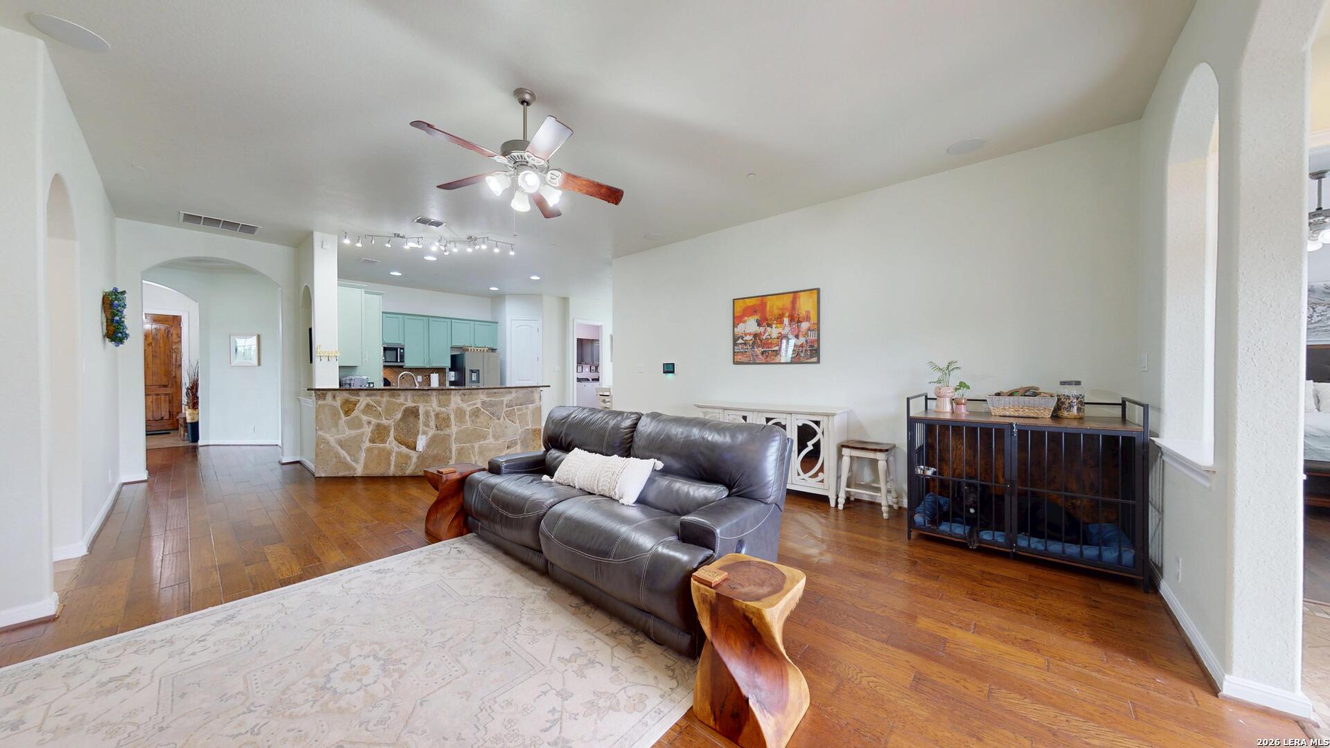 10111 Shallow Bank Converse, TX 78109 - Photo 28 of 65 a living room with furniture and a wooden floor