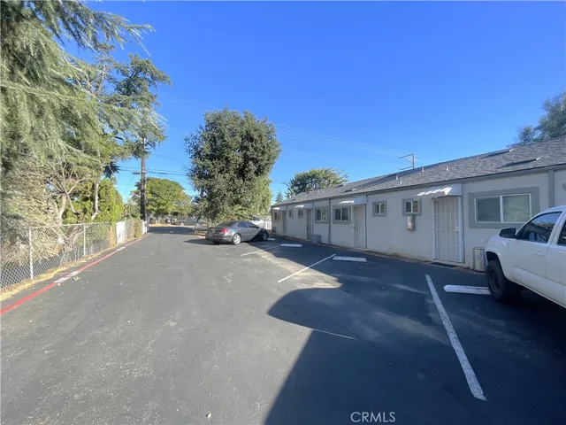 a view of a car park in front of house