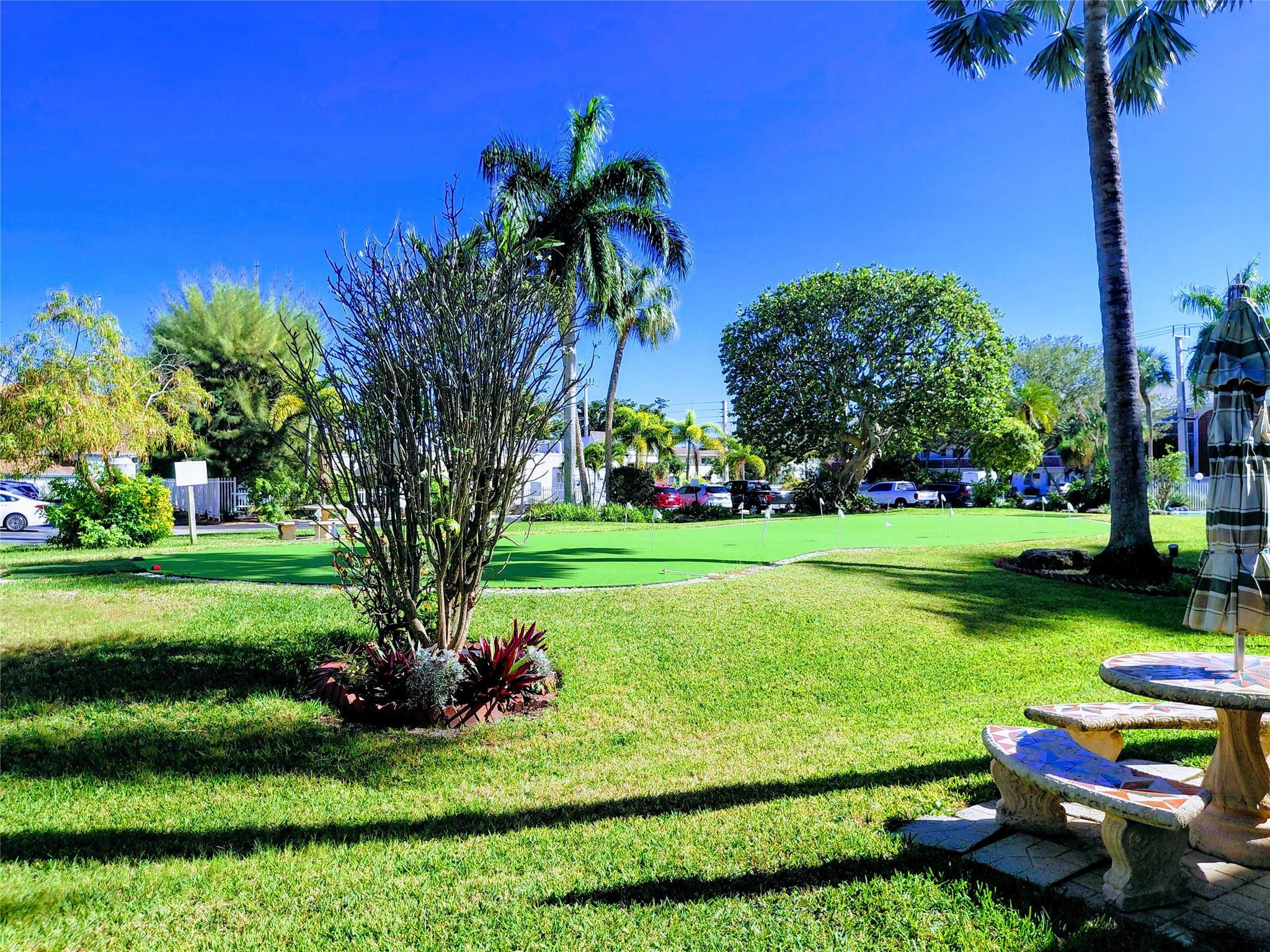 1951 Northeast 39th Street, Unit 127 Lighthouse Point, FL 33064 - Photo 25 of 35 PUTTING GREEN