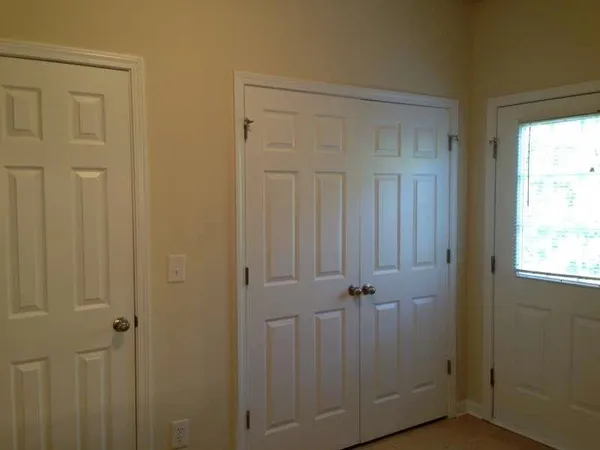a kitchen with a stove and a refrigerator