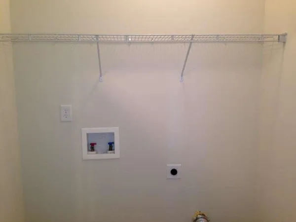 a view of a room with racks on the wall